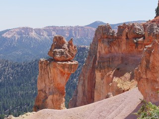 Irregularly eroded spires of red rocks seen from lookout points at Bryce Canyon National Park, Utah.