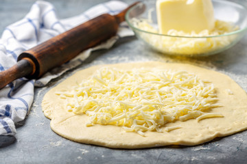 Preparation of traditional pie with cheese.