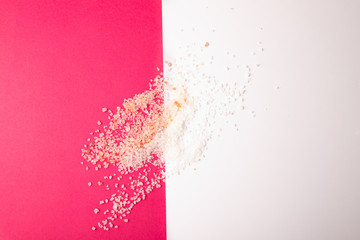 pink or white salt on contrast background