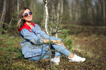 Girl sitting in the forest