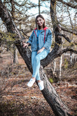 Girl sitting in the forest