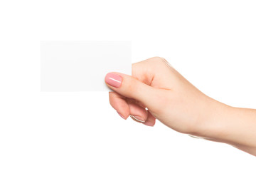 Empty sheet of paper in female hand with manicure isolated on white