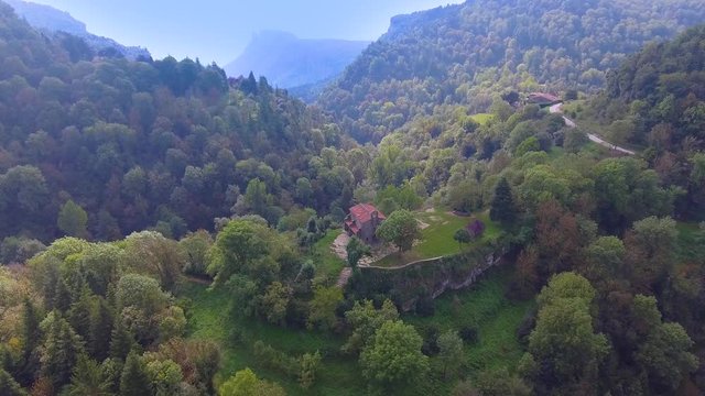 Santa Magdalena Hermitage Church is on top of a mountain hill, near Rupit and full of trees around. Barcelona province, Catalonia, Spain.