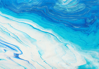 Obraz premium photography of abstract marbleized effect background. blue and white creative colors. Beautiful paint.