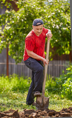 Farmer digging with a shovel