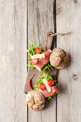 Homemade sandwich on old wooden background