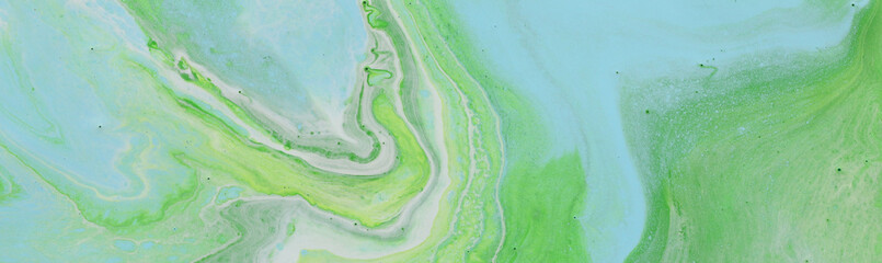 photography of abstract marbleized effect background. blue and green creative colors. Beautiful paint. banner