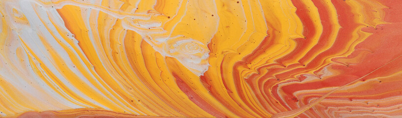 photography of abstract marbleized effect background. gold, yellow, orange and white creative colors. Beautiful paint