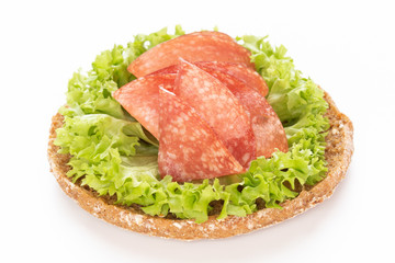 Sandwich with salami sausage on white background.