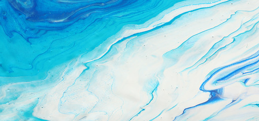 photography of abstract marbleized effect background. blue and white creative colors. Beautiful paint.