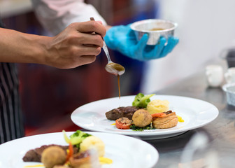 Chef preparing food in the kitchen, chef cooking, Chef decorating dish