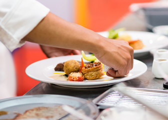 Chef preparing food in the kitchen, chef cooking, Chef decorating dish