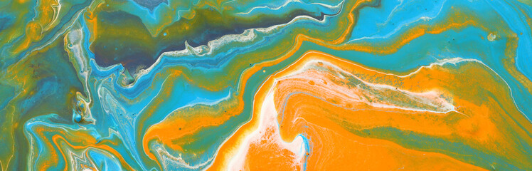 photography of abstract marbleized effect background. gold, yellow, blue and green creative colors. Beautiful paint. banner
