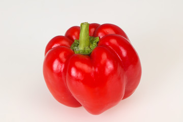 Ripe red bell pepper isolated on white