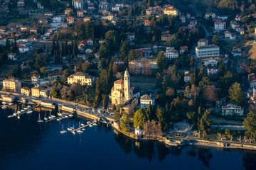Obraz na płótnie Canvas Church of San Lorenzo, flying over Lake Como. Tremezzo, Italy.