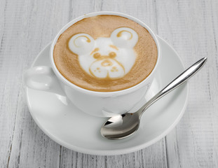 Cup of coffee latte and coffee beans isolated