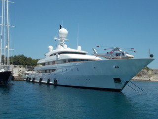 Fototapeta na wymiar big super yacht with own helicopter on deck