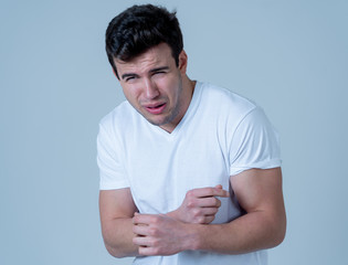 Close up portrait of concern scared shocked adult man with a terrified facial expression