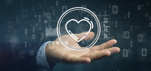 Businessman holding a heart icon surrounded by data