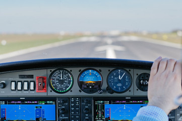 View form a cockpit of a small aircraft alligned on runway and waiting clearance to take off