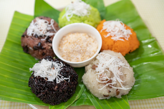Colorful of sticky rice or Xoi on banana leaf with sesame salt. Famous street food for breakfast or fast foot in Vietnam. traditional foot. Royalty high quality free stock image. beautiful sticky rice