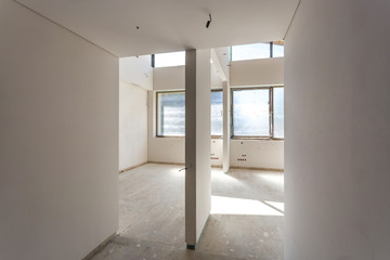 Fototapeta na wymiar Empty room without repair. interior of white wall