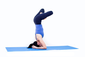 Beautiful Asia girl practicing yoga on isolated white background : Concept practicing