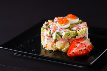 Round salad made of red fish potato and avocado