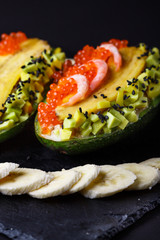 Avocado with banana caviar shrimp and canned tuna