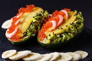 Avocado with banana caviar shrimp and canned tuna
