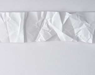 white strip of paper on a white background, copy space