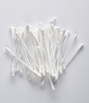 plastic sticks with white cotton for ear cleaning and other hygiene procedures