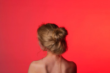 Obraz premium Silhouette of a girl in the studio on a red background. Photoshoot . Photo Studio.