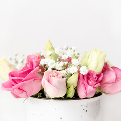 Bouquet of eustoma and gypsophila flowers in front of white background