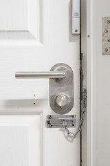 Security Concept. Many lock in only one door.