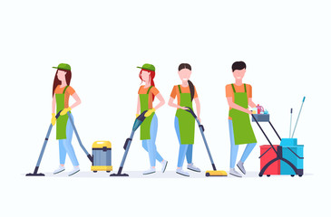 janitors team cleaning service concept male female cleaners in uniform working together with professional equipment flat full length horizontal