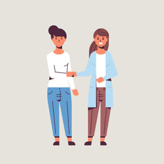 Obraz premium businesswomen handshaking business partners couple hand shake during meeting agreement partnership concept female colleagues standing together flat full length