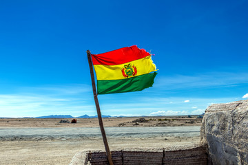 Bolivian Flag waving in the wind against blue sky background
