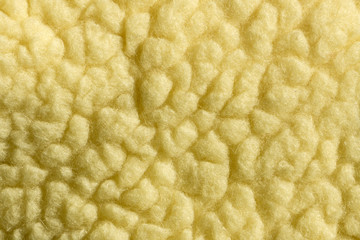 Abstract background, texture in yellow. Natural wool