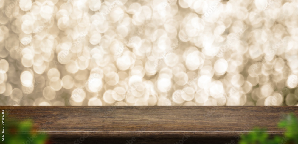 Leinwandbilder empty old rustic dark wood table top with blur sparkling gold bokeh and blur leaf abstract backgroun