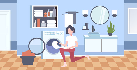 woman putting dirty clothes into washing machine housewife doing housework modern laundry room interior cartoon character full length horizontal flat