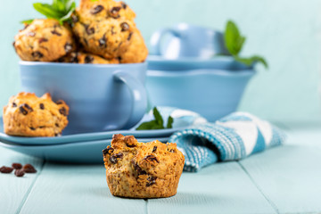 Fresh homemade delicious raisin muffins in blue cup, sugar free. Healthy food concept with copy space.