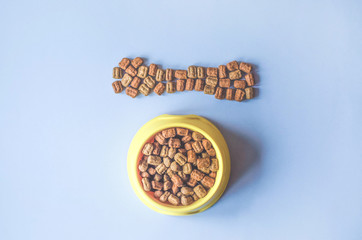 Feed dog food in an original way.