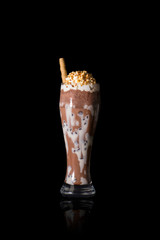 milky chocolate milkshake on black background
