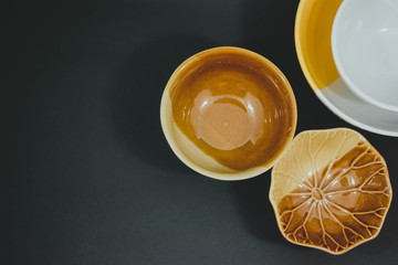 Three cups placed on a black background