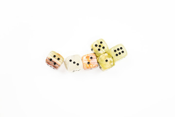 Dices made of natural stone on a white background. Copy space. Gaming.