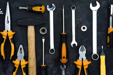 construction tools in wooden box in black background