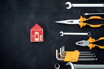 construction tools in wooden box in black background