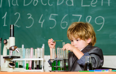 Boy microscope and test tubes school classroom. Knowledge concept. Fascinating subject. Knowledge day. Kid study biology chemistry. Basic knowledge primary school education. Educational experiment