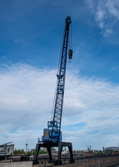 Silhouette of tall crane at Cardiff harbourside